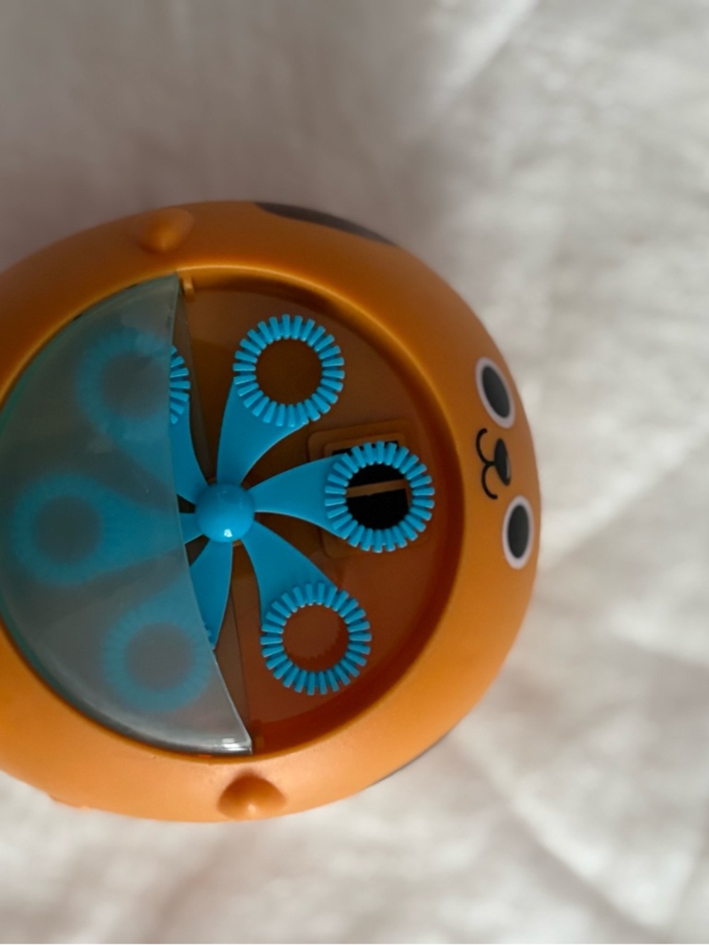 Orange Bubble Machine Toy with Blue Spinner